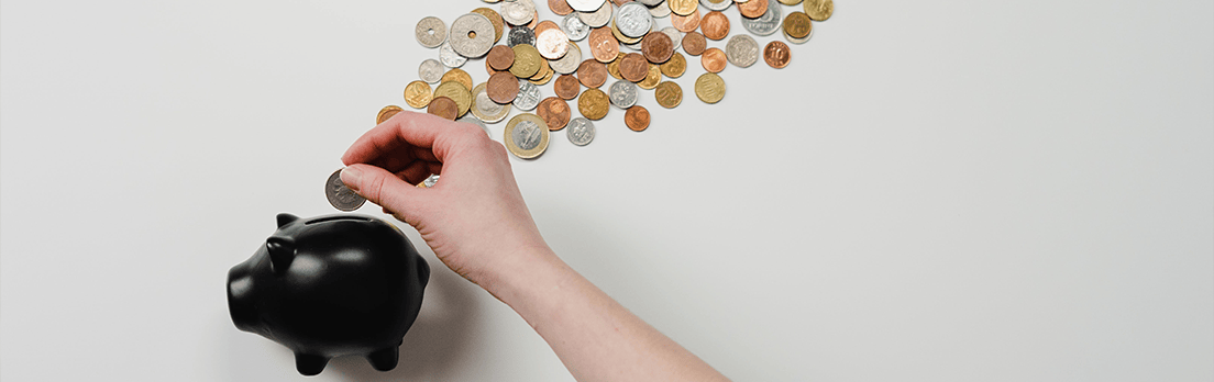 piggy bank with coins on a tabletop